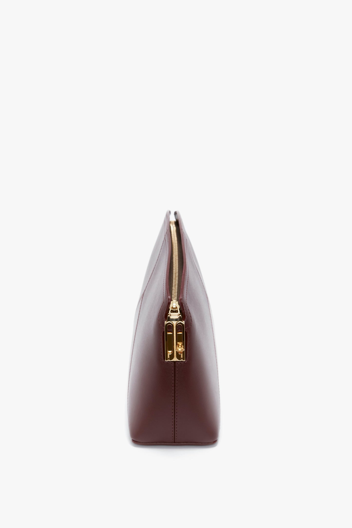 Side view of a closed Victoria Clutch Bag In Burgundy Leather by Victoria Beckham, set against a white background.