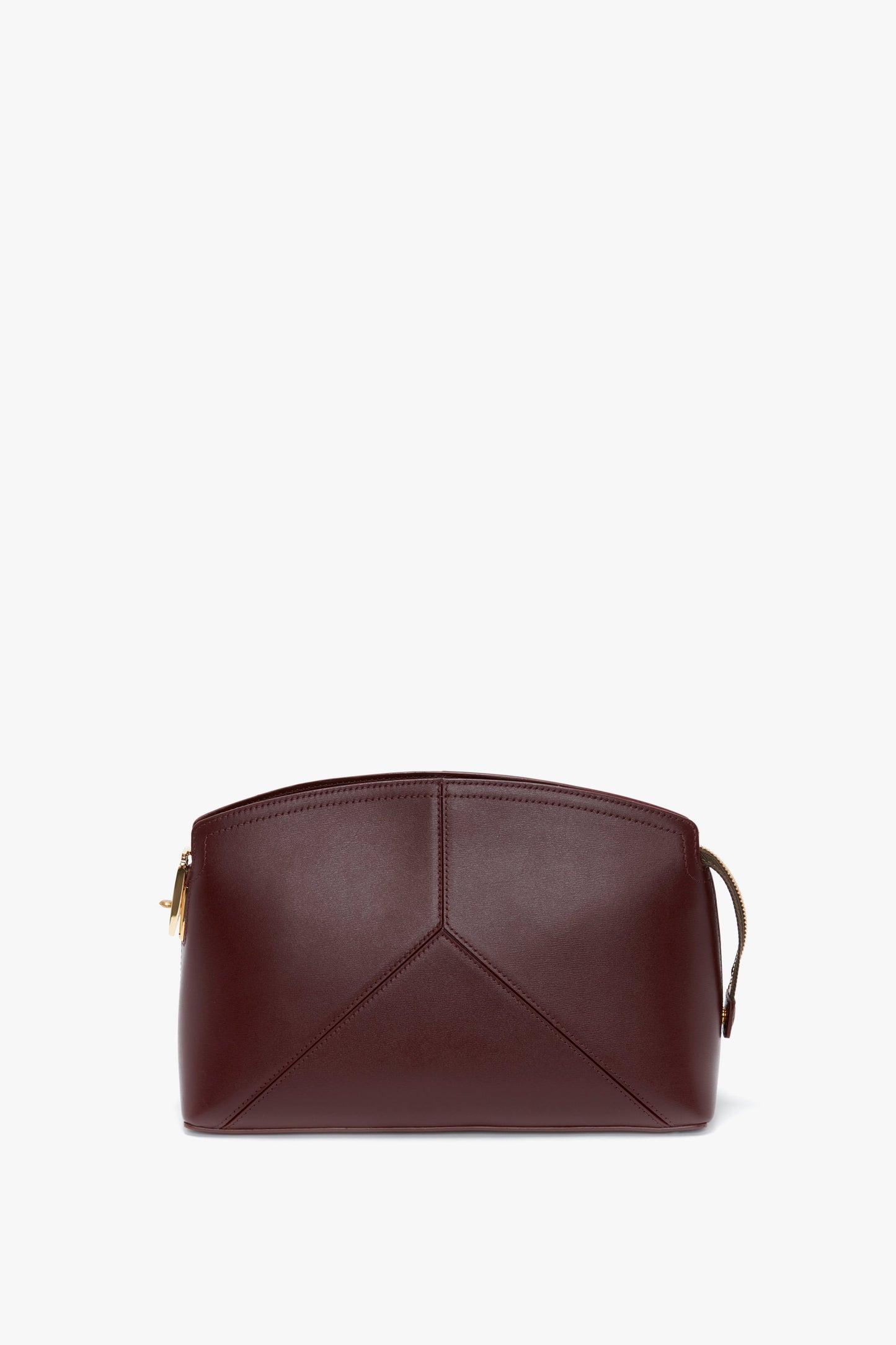 A compact, Victoria Beckham Victoria Clutch Bag In Burgundy Leather with a subtle geometric design on the front and a wrist strap on one side, inspired by Victoria Beckham.