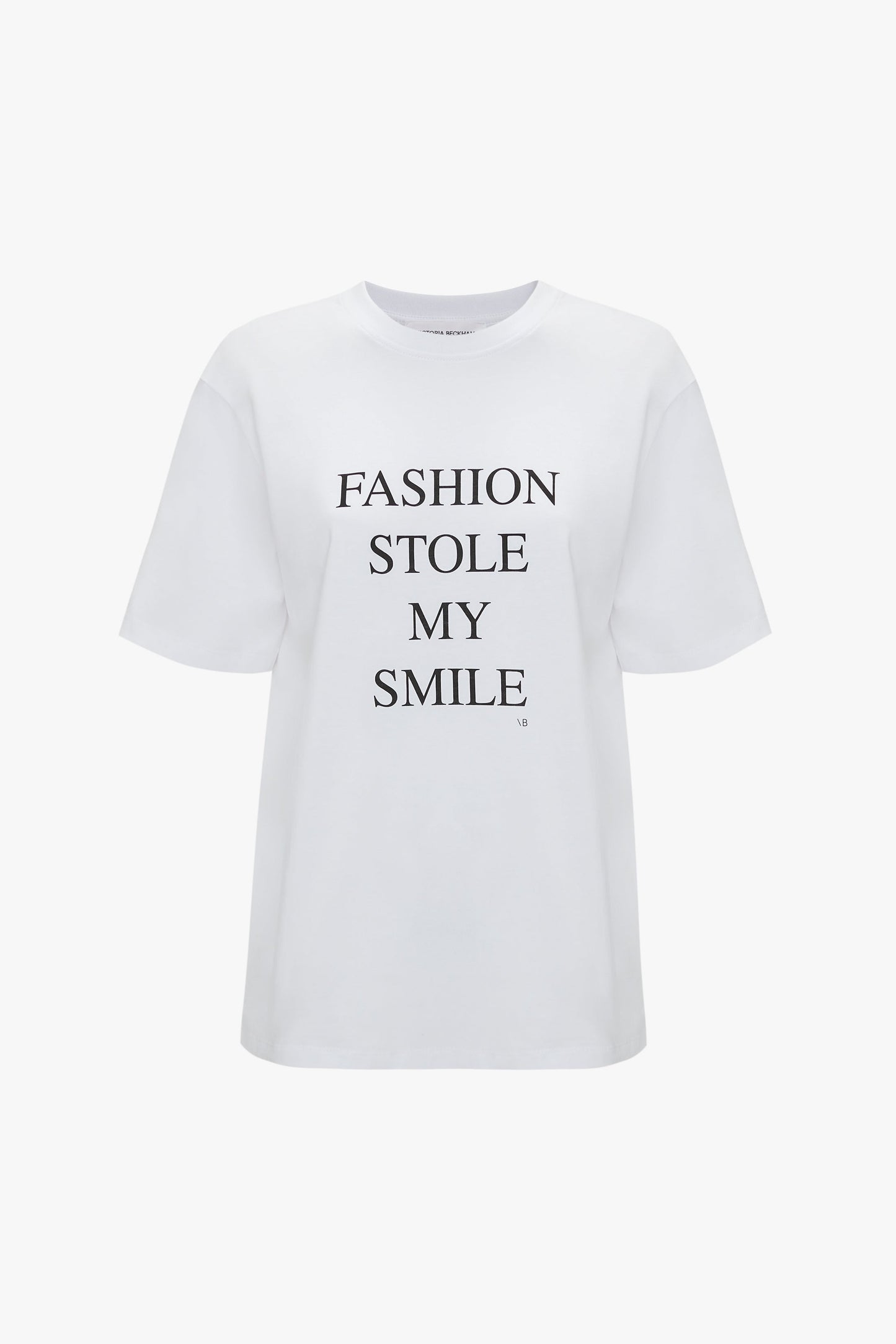 White, relaxed fit Victoria Beckham Fashion Stole My Smile Slogan T-Shirt In White made from organic cotton with the text "FASHION STOLE MY SMILE" printed in bold black uppercase letters on the front.