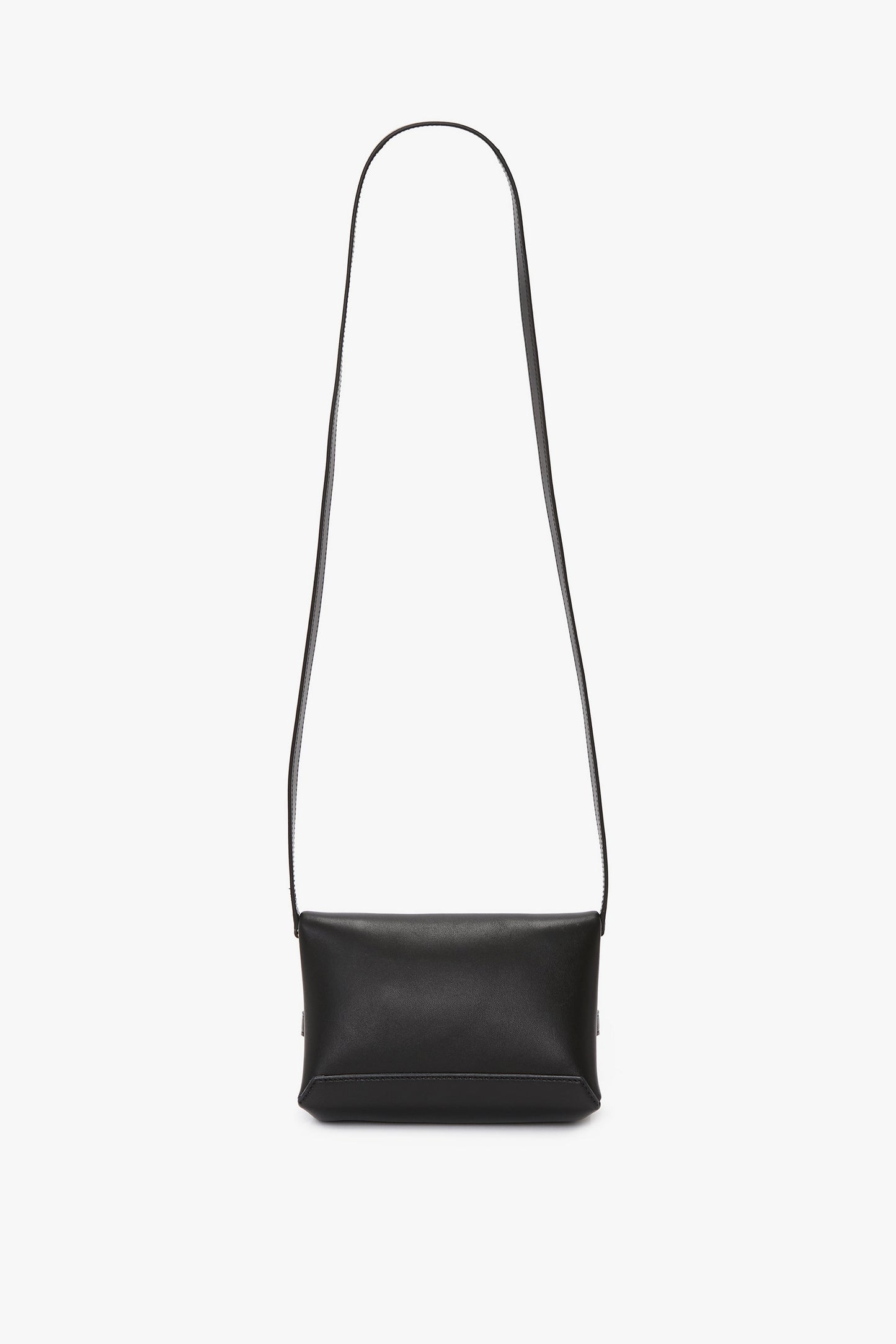 **Mini Chain Pouch Bag With Long Strap In Black Leather by Victoria Beckham**, crafted from luxurious lambskin leather, with a long strap, displayed on a plain white background.