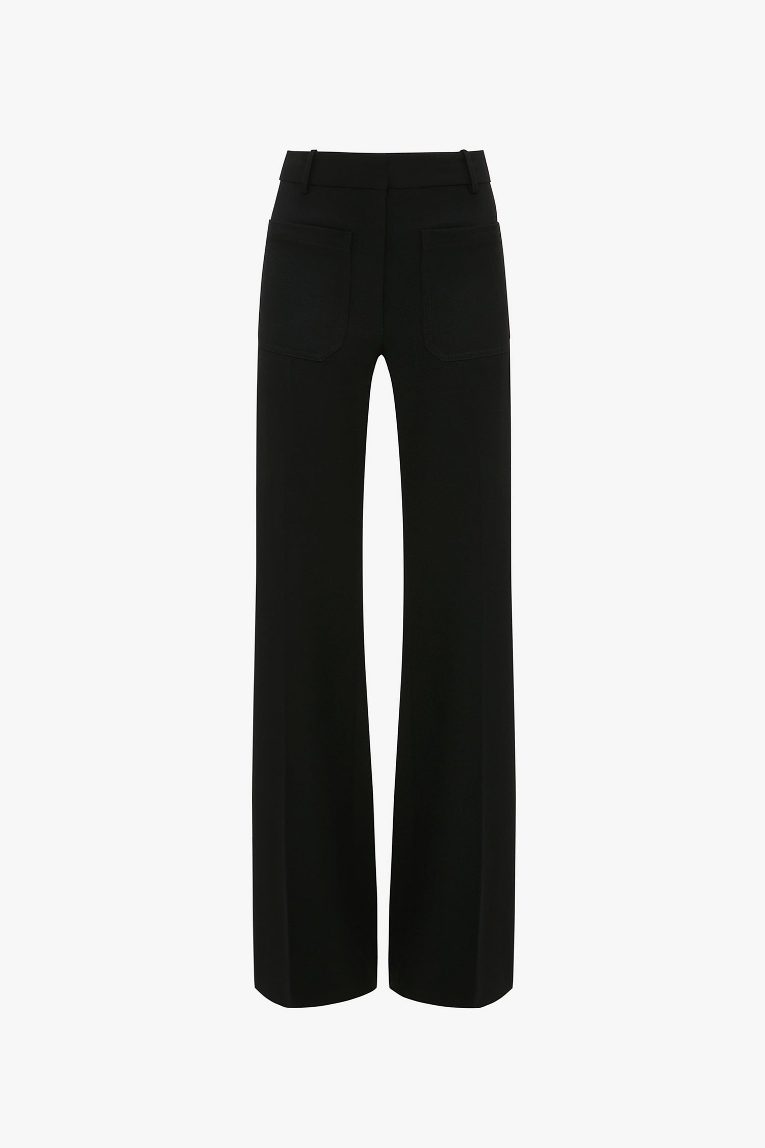 A pair of black trousers viewed from the back, featuring belt loops, two back pockets, and straight legs. Designed with subtle nods to 70s style references, these Victoria Beckham Alina Tailored Trouser In Black add a touch of retro sophistication.