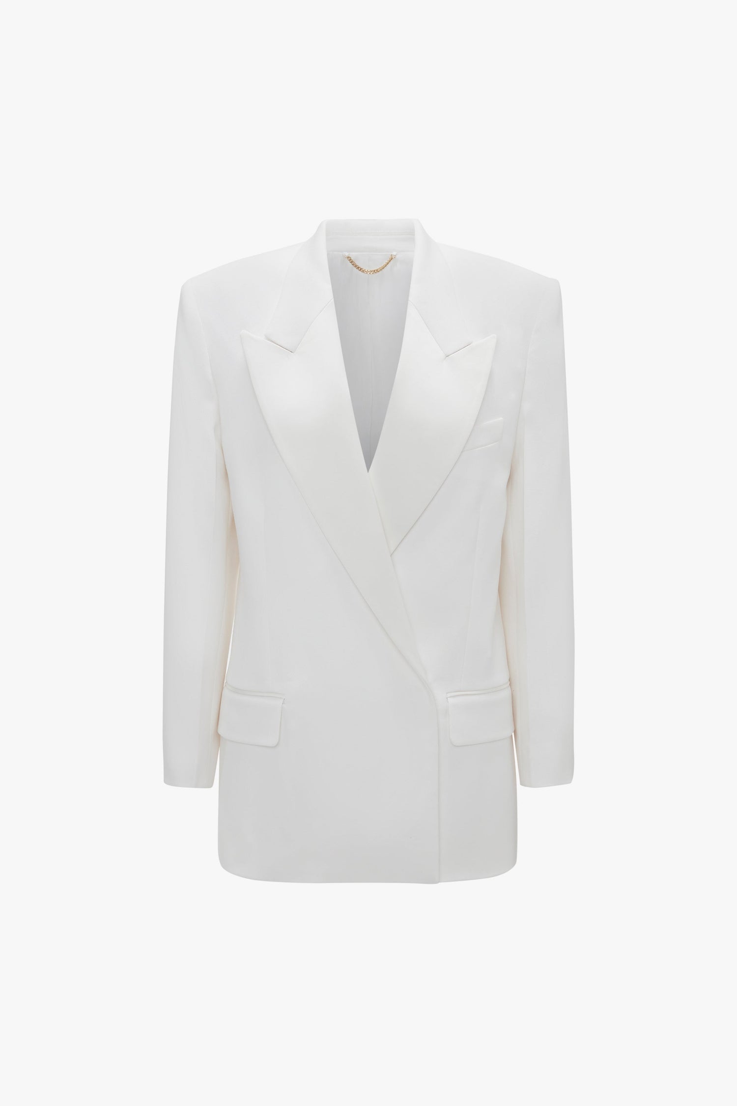 A white, double-breasted blazer with satin peak lapels, front flap pockets, and a structured silhouette. The Exclusive Double Breasted Tuxedo Jacket In Ivory by Victoria Beckham brings a tuxedo style elegance to your ensemble.