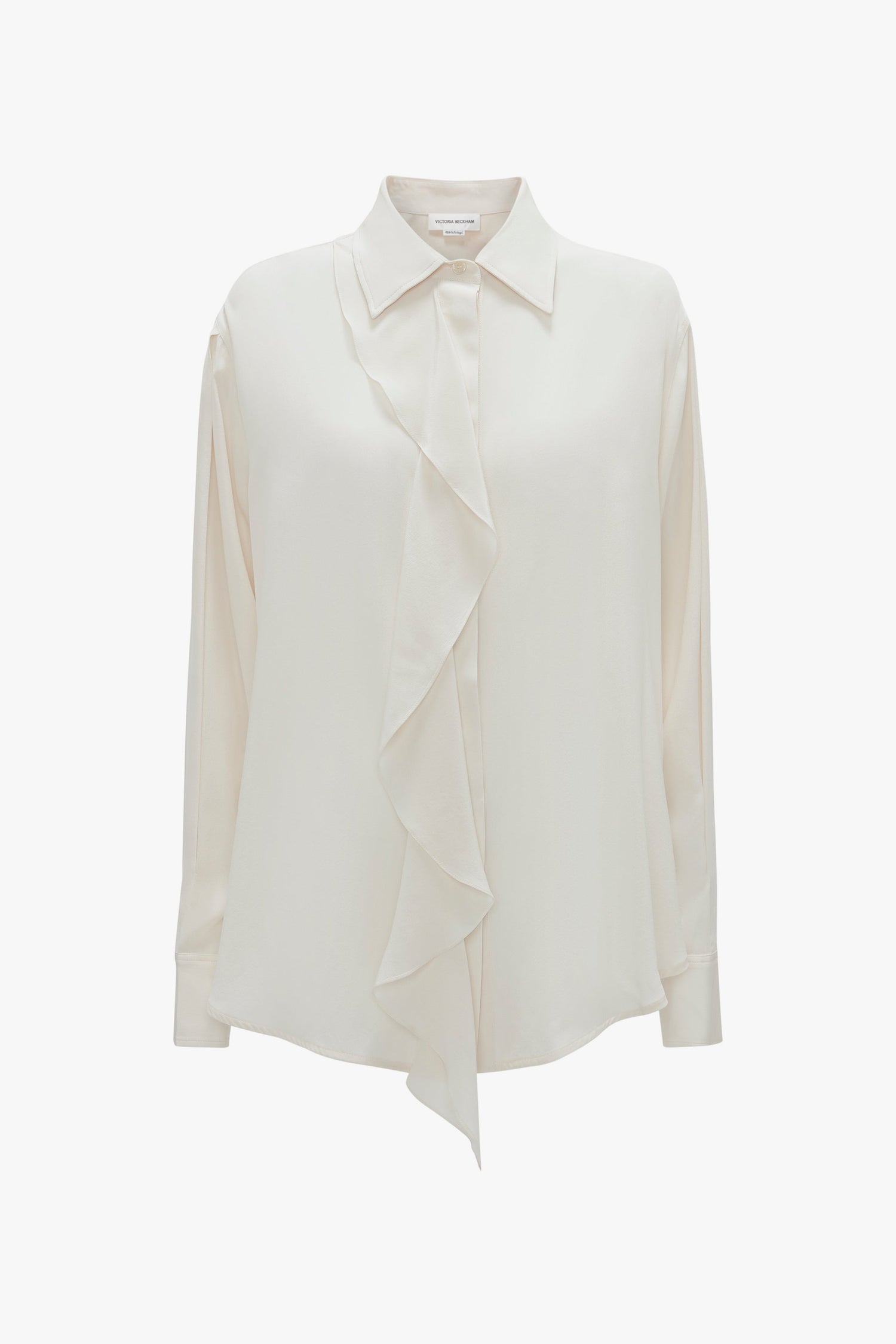 An Asymmetric Ruffle Blouse In Ivory by Victoria Beckham with a collared neckline and voluminous sleeves is displayed against a plain background.