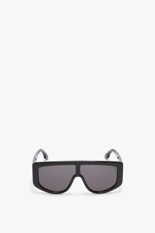 A pair of Acetate Visor Sunglasses In Black by Victoria Beckham, positioned against a white background.