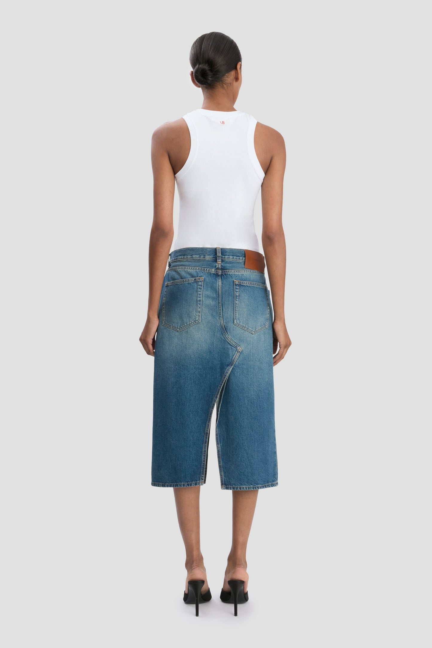 Kick Pocket Denim Skirt In Mid Blue Wash