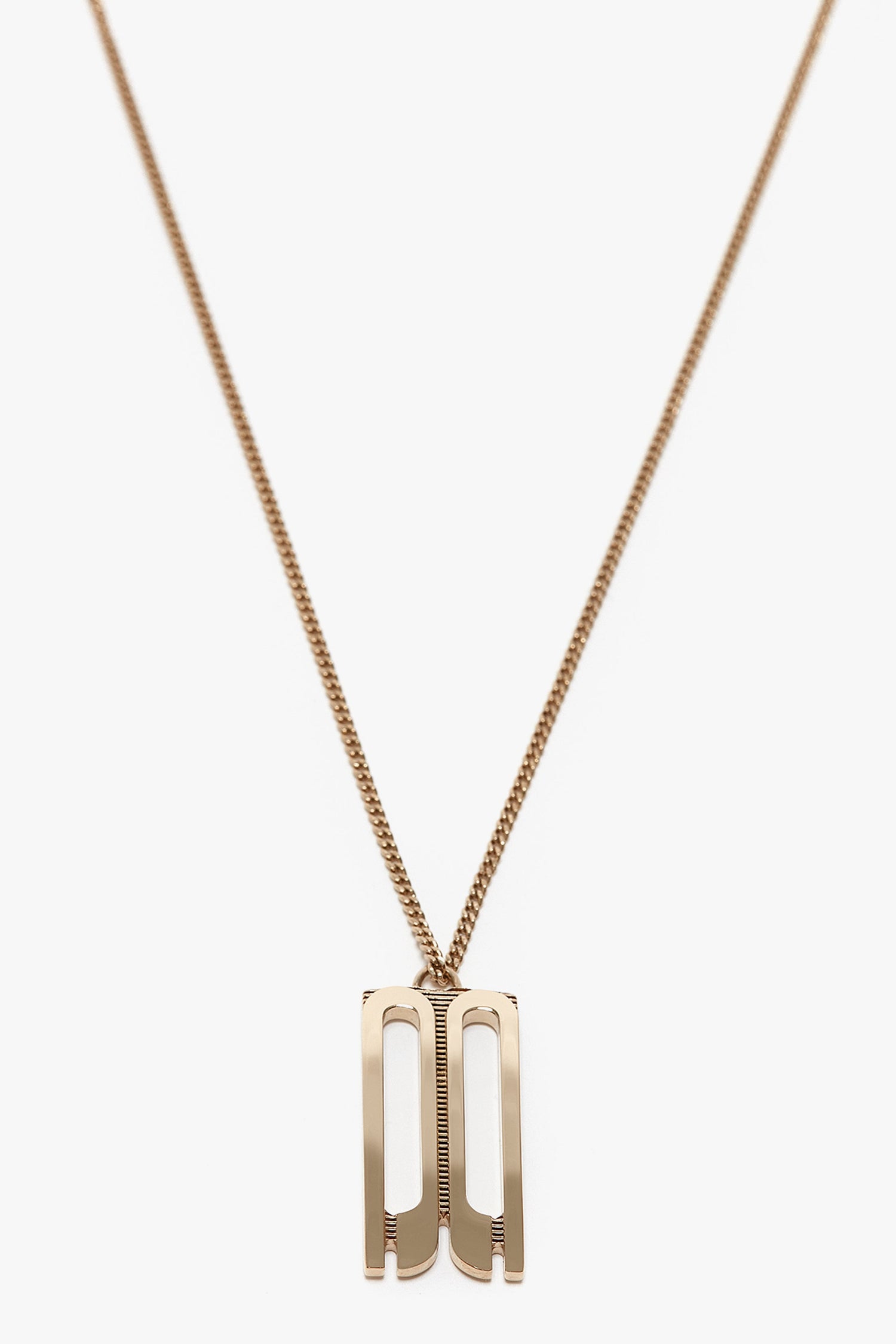 Exclusive Frame Necklace In Gold with a thin chain featuring a Frame Charm Pendant shaped like the letters "PA" in a modern style, reminiscent of Victoria Beckham accessories.
