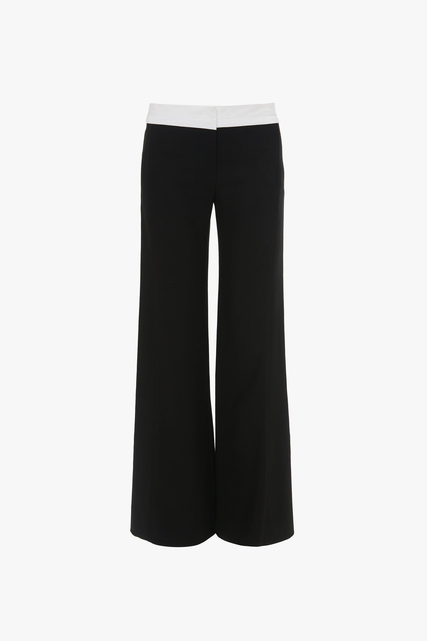 A pair of Side Panel Trouser In Black by Victoria Beckham with a contrasting white waistband, displayed on a plain white background. Featuring a tailored trousers look and wide-leg design, these pants effortlessly blend style and comfort.