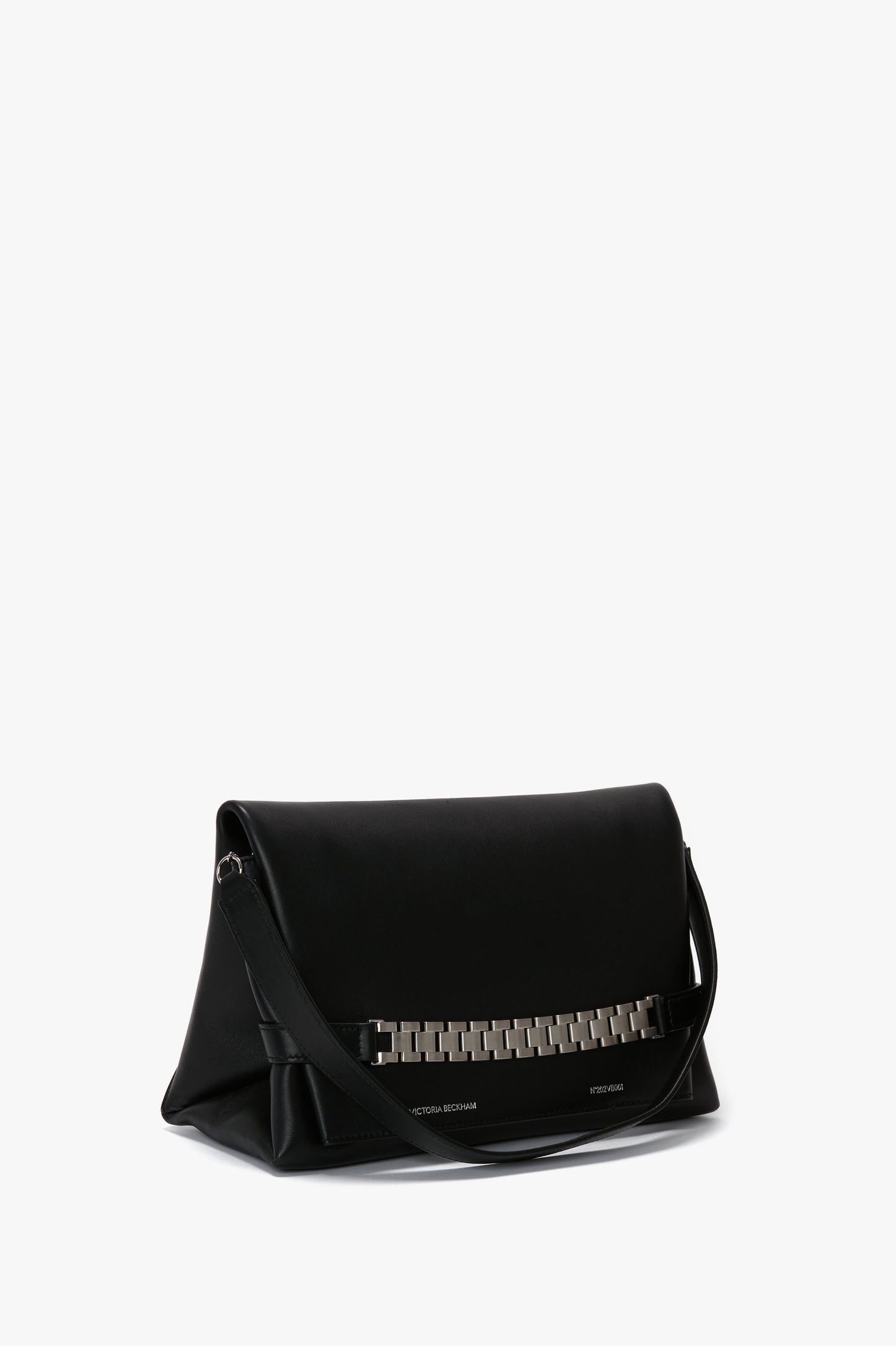 A black leather Chain Pouch Bag with Brushed Silver Chain In Black Leather by Victoria Beckham featuring a brushed silver chain detail on the front and a detachable strap.