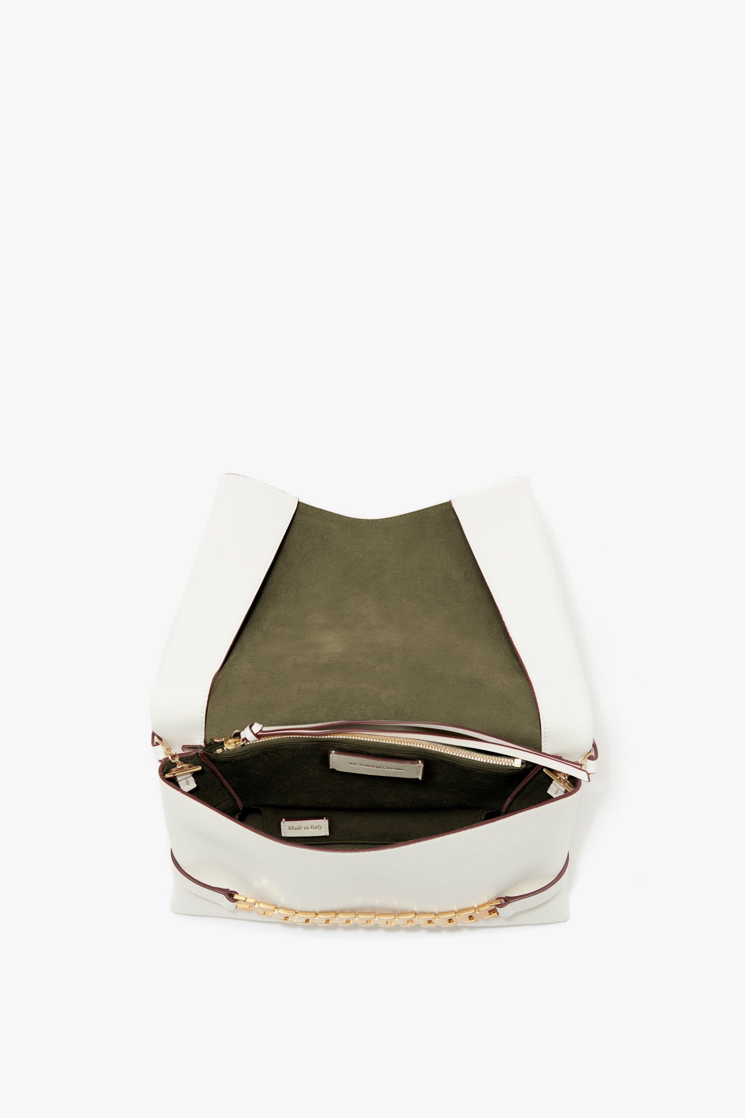 Open Chain Pouch Bag With Strap In White Leather by Victoria Beckham with olive green interior lining, featuring a small inner zipped pocket and gold-tone chain detail. Crafted from tactile Nappa leather, it includes a detachable strap for versatile wear.