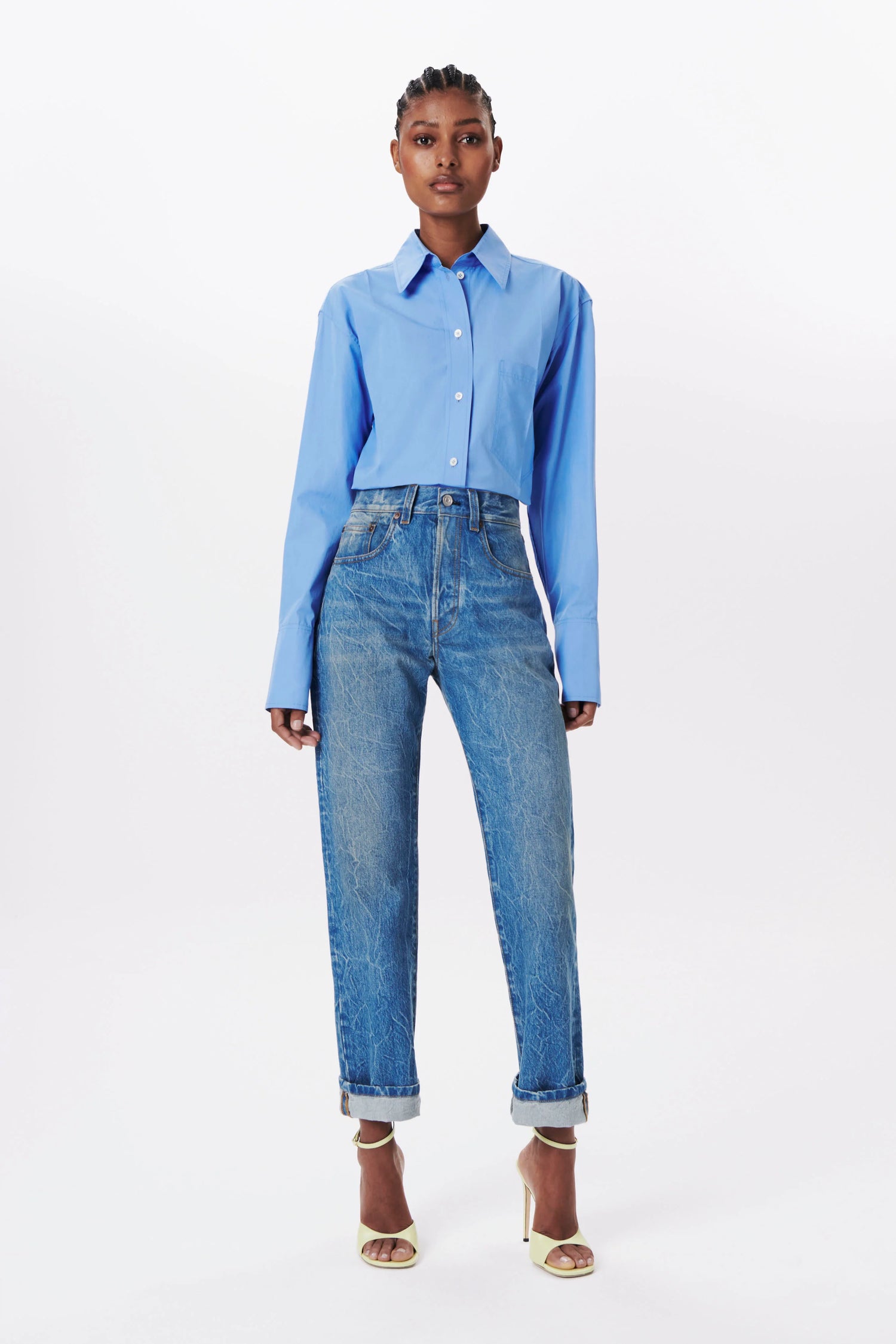 The Cropped Long sleeve shirt in Oxford Blue made from cotton poplin. This designer blouse from VB also features a boxy fit with white buttons.